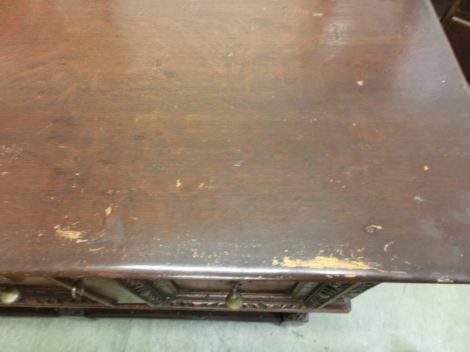 A 17th century style oak dresser base, the top over three panel front drawers over carved legs and - Image 11 of 12