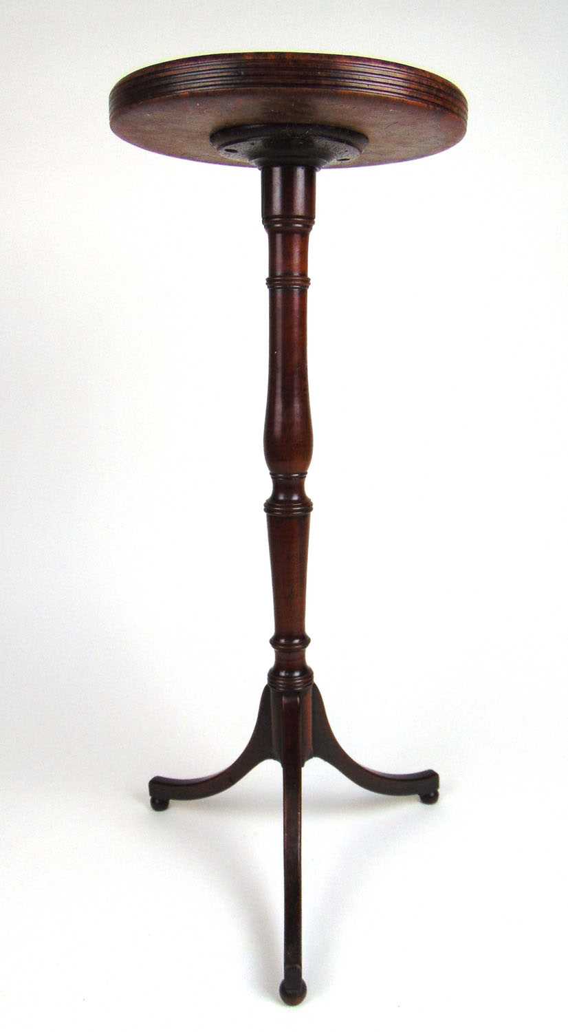 An 18th century fruitwood tripod table/candle stand base with a dish amboyna top, h. 72 cm, dia.