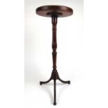 An 18th century fruitwood tripod table/candle stand base with a dish amboyna top, h. 72 cm, dia.