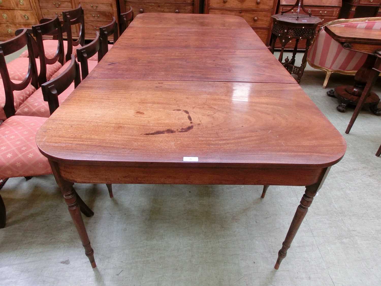 An early 19th century and later mahogany extending dining table, the two D-ends on turned legs - Image 4 of 16