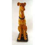 A large Italian glazed model of a dog, h. 108 cmCrazing to glaze. Glaze chipped to one ear.