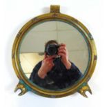 A brass porthole frame with later mirror insert, dia. 30 cm