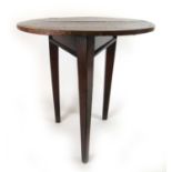 A 19th century and later oak cricket table, the circular top on three legs, h. 72 cm, dia. 68 cmMade