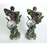 Two 19th century Meissen porcelain models of birds defending their nests, h. 22 cmOne bird with