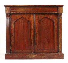 A 19th century rosewood side cabinet, the top over single drawer and two cupboard doors on plinth