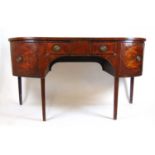 A George III mahogany, boxwood and ebony strung bow front sideboard, the central drawer flanked by