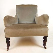 An Edwardian walnut armchair upholstered in a cut grey fabric on turned front legs, h. 90 cm, w.