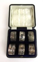 A cased set of six eastern white metal niello work napkin rings. Approx weight 117g