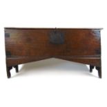 A late 17th century oak six plank coffer, the top lifting to reveal a vacant interior, h. 62 cm,