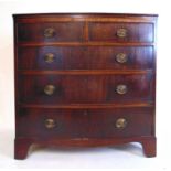 A late 18th century mahogany bow front chest of two short over three long drawers on bracket feet,
