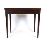 An 18th century mahogany card table, the fold over top supported on a single gate action on square