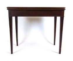 An 18th century mahogany card table, the fold over top supported on a single gate action on square