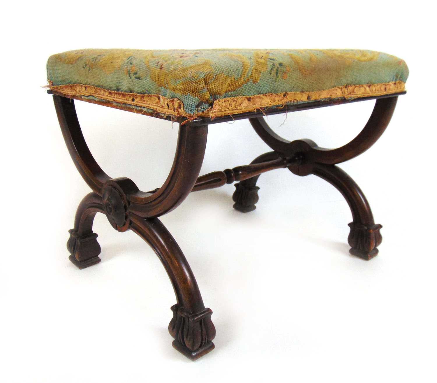 An early 19th century rosewood X-frame stool, the floral needlework seat over the moulded frame with