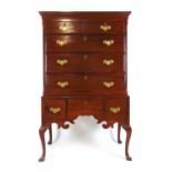 An 18th century and later mahogany chest on stand, the cavetto cornice over two short and three long