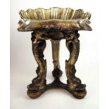 An early 20th century silvered grotto stool, the shell seat supported on three dolphin legs, h. 57
