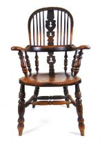 A 19th century ash and elm Windsor chair, the hoop back with pierced splat and turned supports