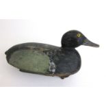 A late 19th/early 20th century painted wooden decoy duck, l. 38 cm