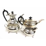 An Elizabeth II silver four piece tea and coffee set with Greek key design to rims. Hallmarked for