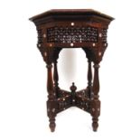 A late 19th century Moorish carved and mother of pearl inlaid occasional table. the octagonal top