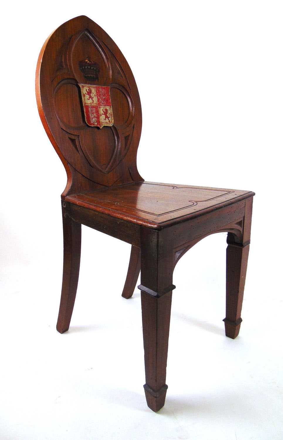 An early 19th century mahogany Gothic hall chair, the carved quatrefoil back with armorial shield - Image 4 of 4
