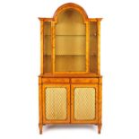 An early 20th century, 18th century style satinwood bookcase/display cabinet, the dome top over
