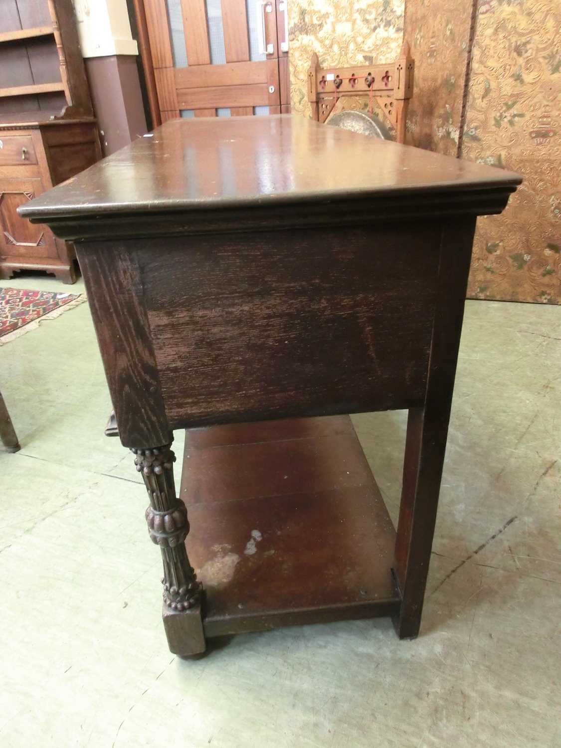 A 17th century style oak dresser base, the top over three panel front drawers over carved legs and - Image 9 of 12