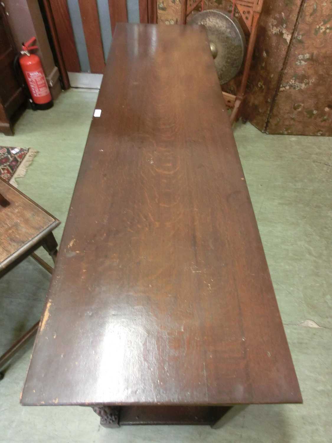 A 17th century style oak dresser base, the top over three panel front drawers over carved legs and - Image 12 of 12