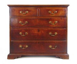 A mid 18th century oak chest of two short over three long drawers on bracket feet, h. 91 cm, w.