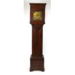 An 18th century elm and oak long case clock, the engraved brass face with single hand and Roman