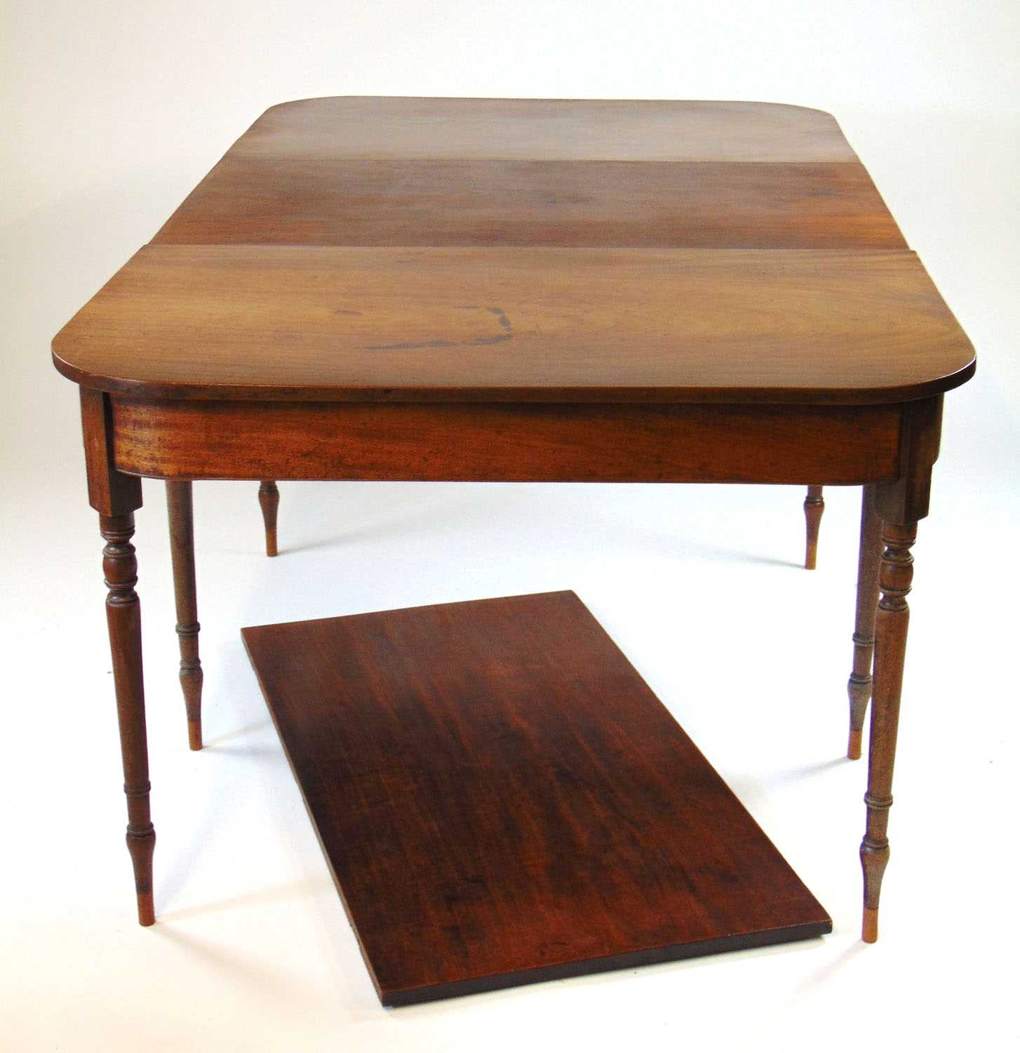 An early 19th century and later mahogany extending dining table, the two D-ends on turned legs - Image 2 of 16