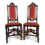 A matched pair of Continental early 18th century walnut side chairs upholstered in a pink fabric, h.