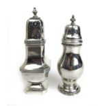 A George V silver sugar castor together with an Edwardian silver sugar castor. Various hallmarks.