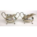 A George V silver cream jug and sugar bowl. Hallmarked for Sheffield 1936, makers mark for Viners