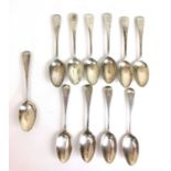 A set of ten Victorian silver table spoons with armorial engraving to handles together with one