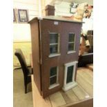 An early 20th century doll's house, single chimney stack over two floors with floral