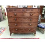 An early 19th century mahogany chest of two frieze drawers, above two short over three long