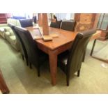 A modern hardwood dining table with slate insert to center along with a set of six matching