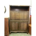 An early 20th century walnut escritoire, open storage over the fall front with birds eye maple