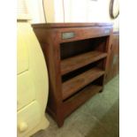 A modern hard wood open bookcase with slate inserts