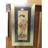 A framed and glazed Japanese print of geisha girl with pekingese dog