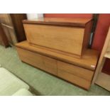 Two mid-20th century teak units, both with fall front alongside two drawers