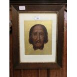 An oak framed and glazed possible painting of Jesus' head on gold paper