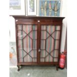 An 18th century mahogany and boxwood strung display cabinet, two astragal glazed doors with