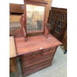 An Edwardian walnut dressing chest, the bevelled plate over two short and two long drawers