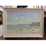 A framed oil on canvas of beach scene signed Richard Blowey