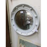 A white painted Regency style convex mirror