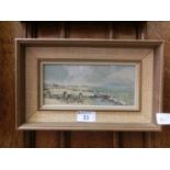 A framed oil on board of beach scene signed A.E.Webster