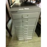 A grey metal ten drawer tool chest