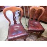 A pair of Victorian balloon back dining chairs