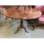 An 18th century style tilt top circular table